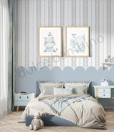 Children's bedroom with striped pattern scalloped wallpaper,framed illustrations on the wall, a bed, and nightstands.