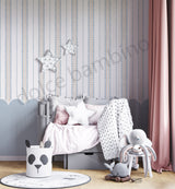 Children's room with striped pattern scalloped wallpaper,a crib, toys, and decorative elements.