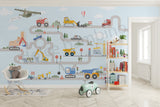 Children's room with a large wall mural of a road with vehicles and construction elements.