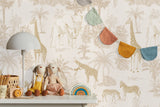 Children's room with safari elements on a wallpapered wall,toys, and a lamp.