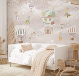 A wall mural featuring whimsical animal characters in a sky with hot air balloons, presented in a room setting with a furniture