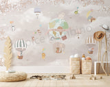 A wall mural featuring whimsical animal characters in a sky with hot air balloons, presented in a room setting with a rug & furniture
