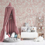 A Kids room featuring a whimsical wallpaper with animal illustrations in a pastel color palette.