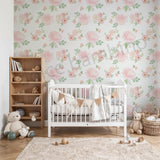 Nursery room with floral wallpaper, white crib, wooden bookshelf, and toys.