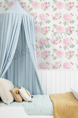 Children's room with floral wallpaper, canopy bed, and soft colors.